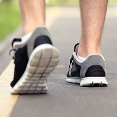 Man wearing running shoes on the track